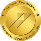 A gold seal that says the joint commission national quality approval.