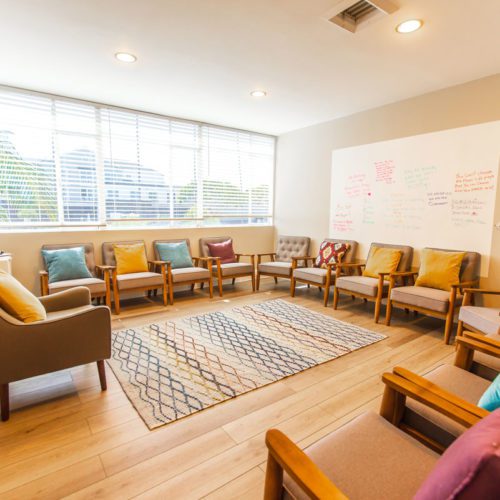 A room with many chairs and tables in it