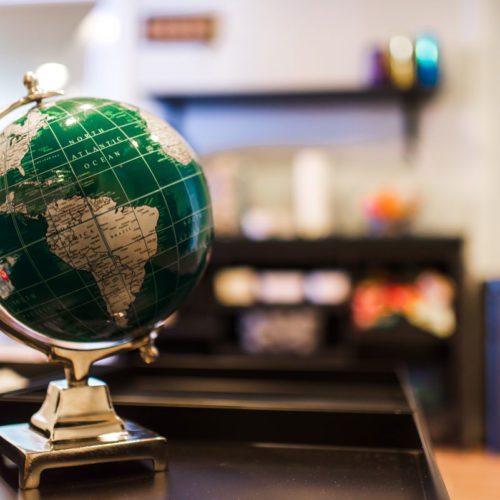A globe sitting on top of a desk.
