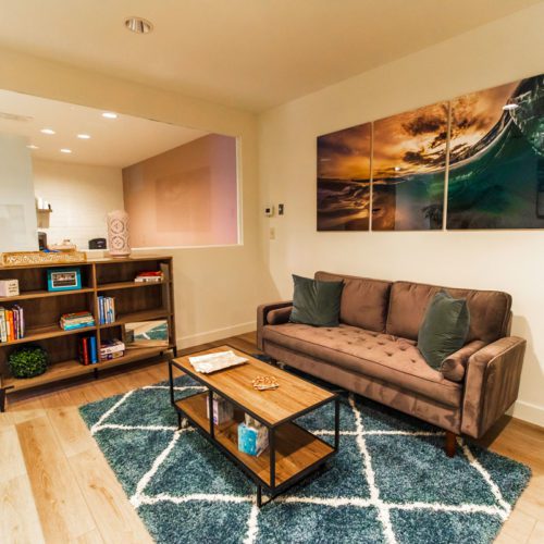 A living room with a couch and coffee table